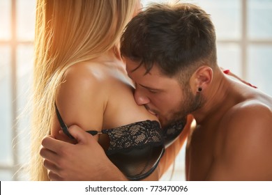 kissing huge boobs