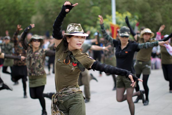 bernadette donovan add chinese girl dancing in military uniform photo