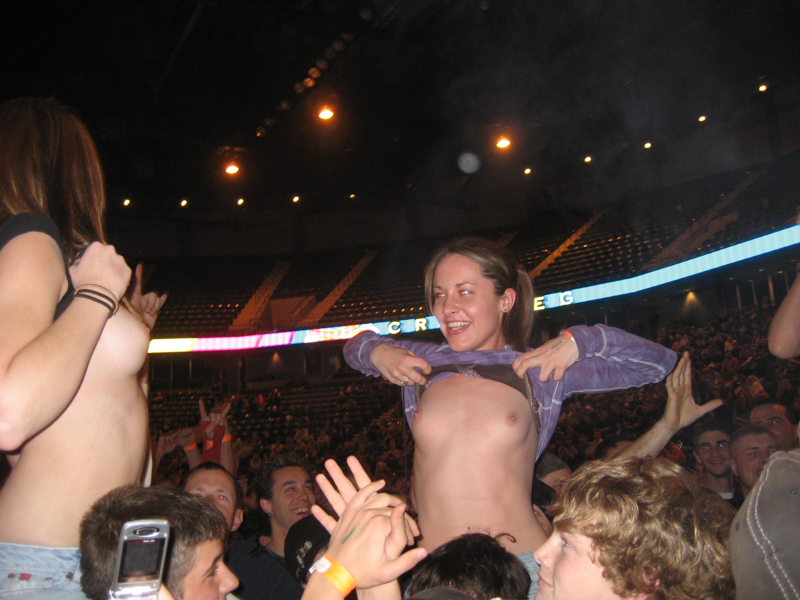 women flashing at concerts